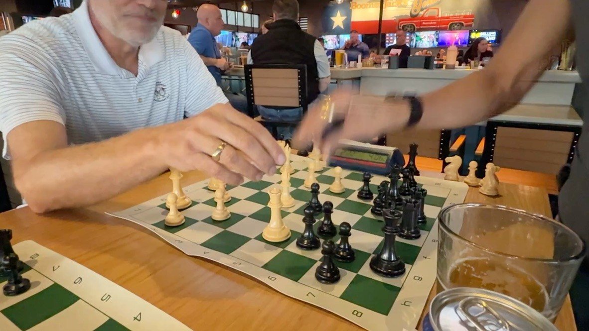 A player reaching to make a move