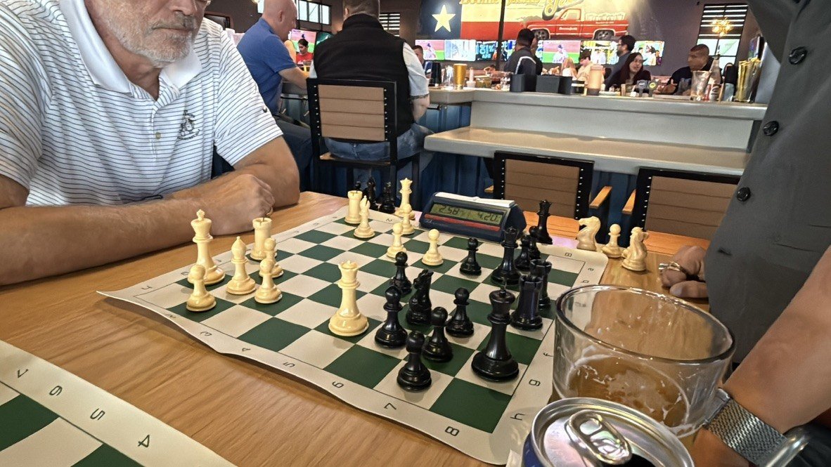 Middlegame position with the Boomerjack's Texas flag in the background