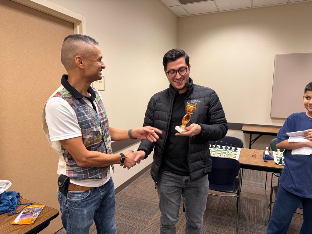 Jay congratulates champion David with a handshake